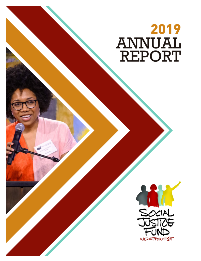 Front cover of the 2019 annual report. Rectangular image with white background. Layered chevron shapes in orange, crimson, and light blue point from the left side of the image to the right. Inside the chevrons is a picture of Carolanne Sanders SJF board member a Black woman wearing a pink and orange dress with a fro smiling and speaking into a microphone. Black text reads 2019 annual report. The SJF logo is in the bottom right corner.