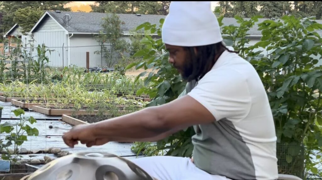 A photo of Black Agriculture Leadership Council founder JT farming on his land.